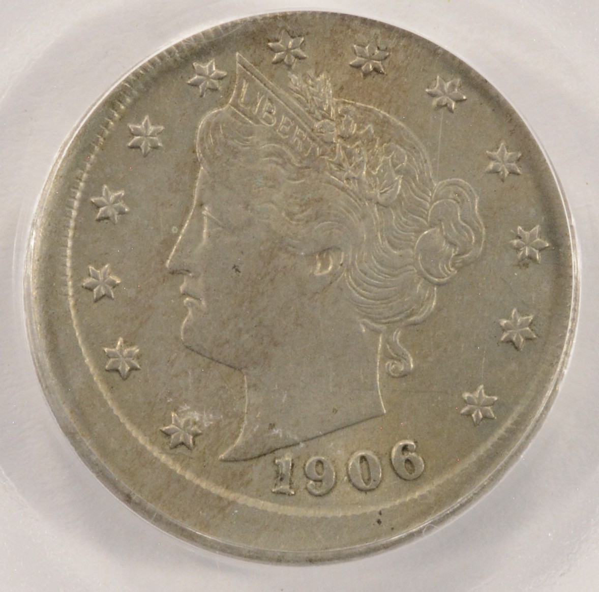 1906 Liberty Head Nickel struck off-center approximately 25%, showing Liberty design shifted with a crescent of unstruck planchet metal visible; date remains readable